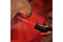 Image Two mouths holding a Lelo lipstick inbetween.